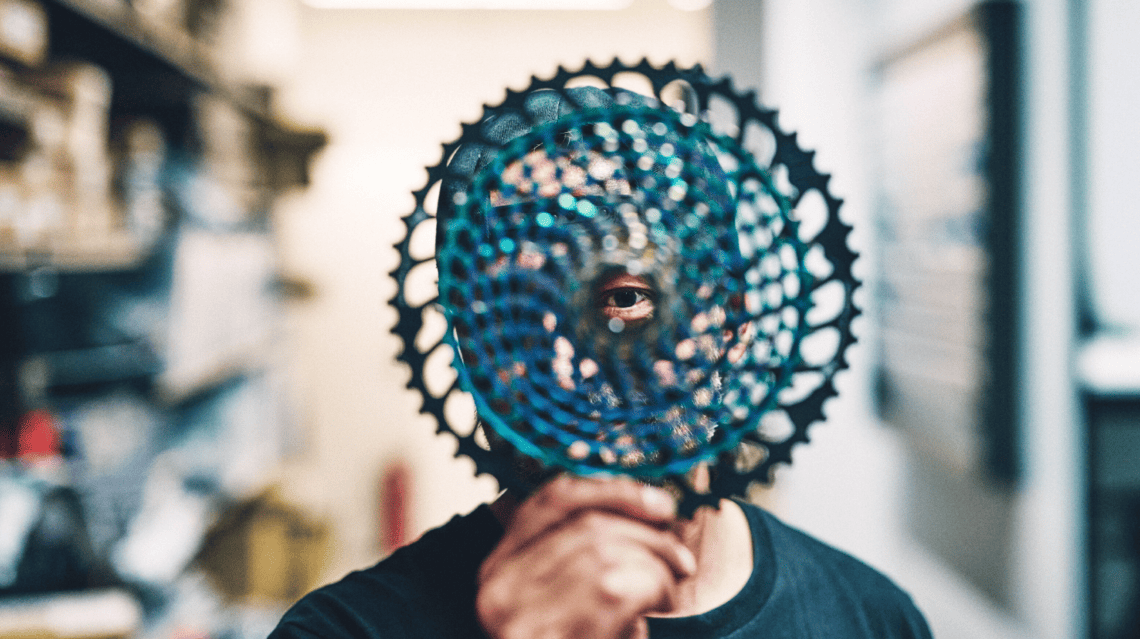 Professional bike mechanic performing maintenance at a Giant Store service area.