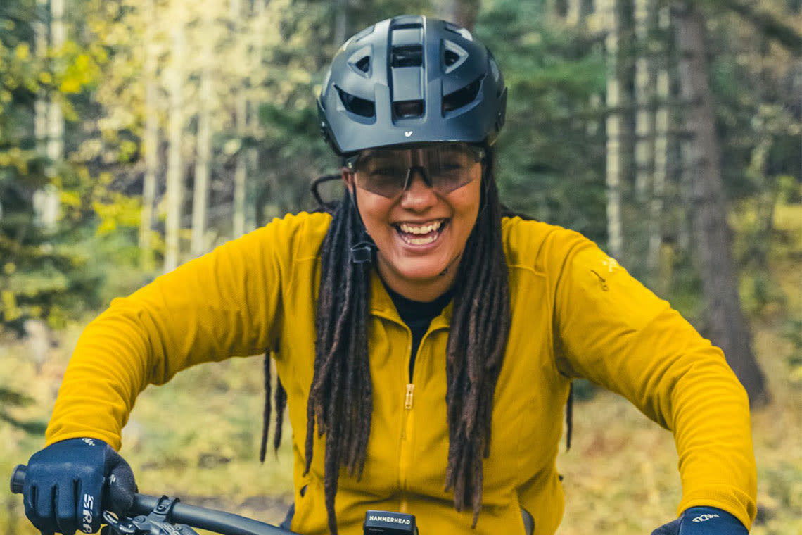 Woman smiling on a bike
