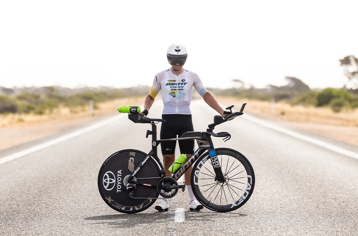 Brendan "Trekky" Johnston standing with his Giant Trinity SL.