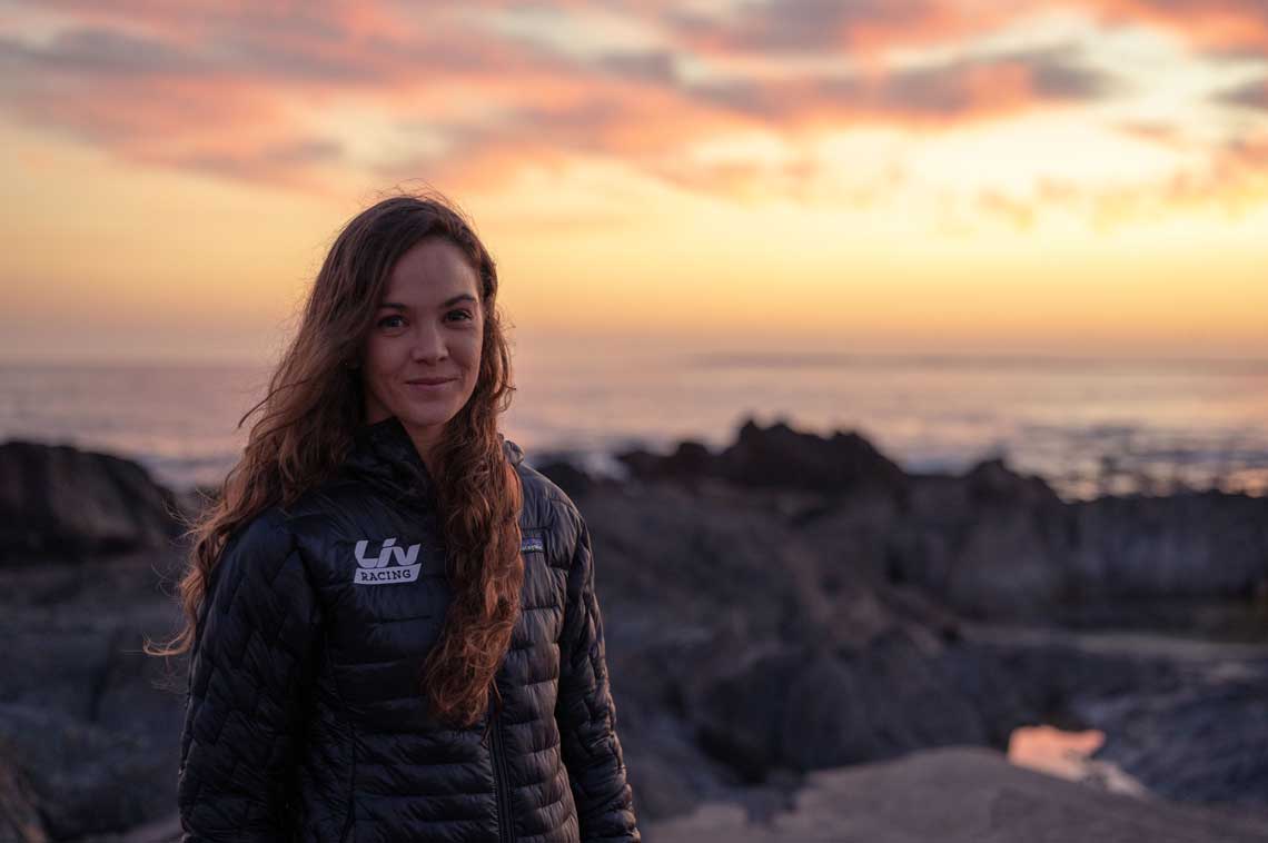 Sarah Hill smiling outdoors at sunrise