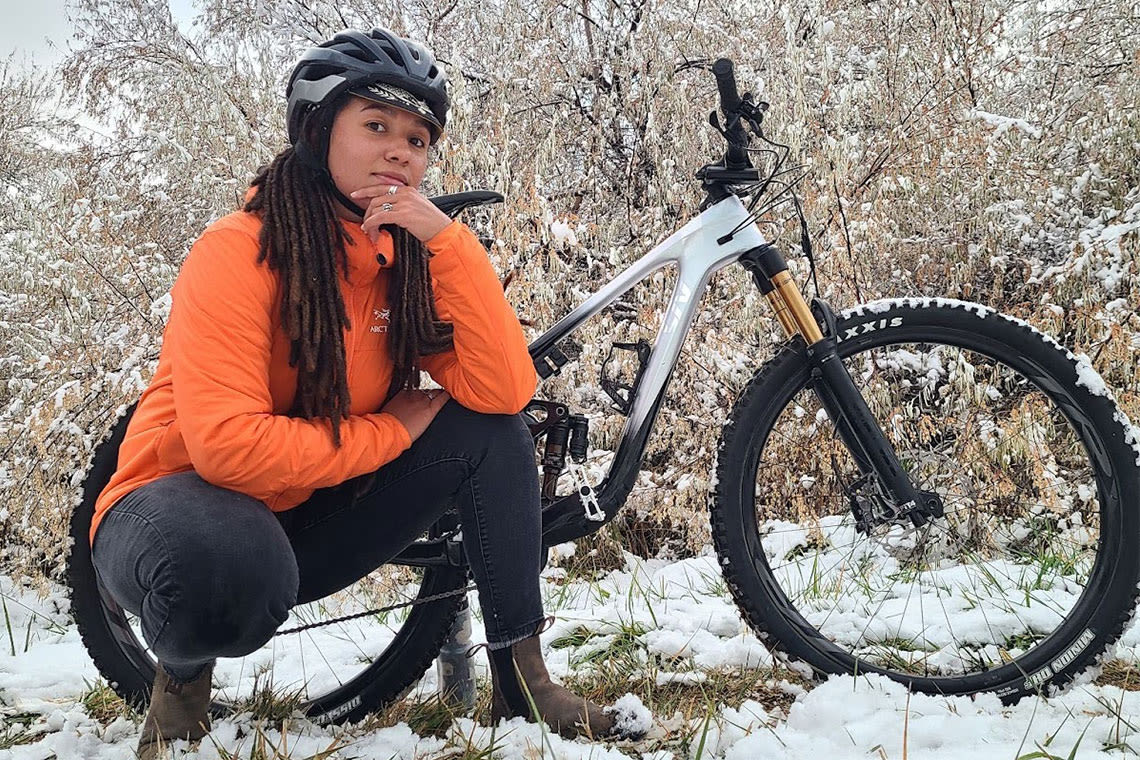 Woman wearing a helmet and cycling cap in the snow