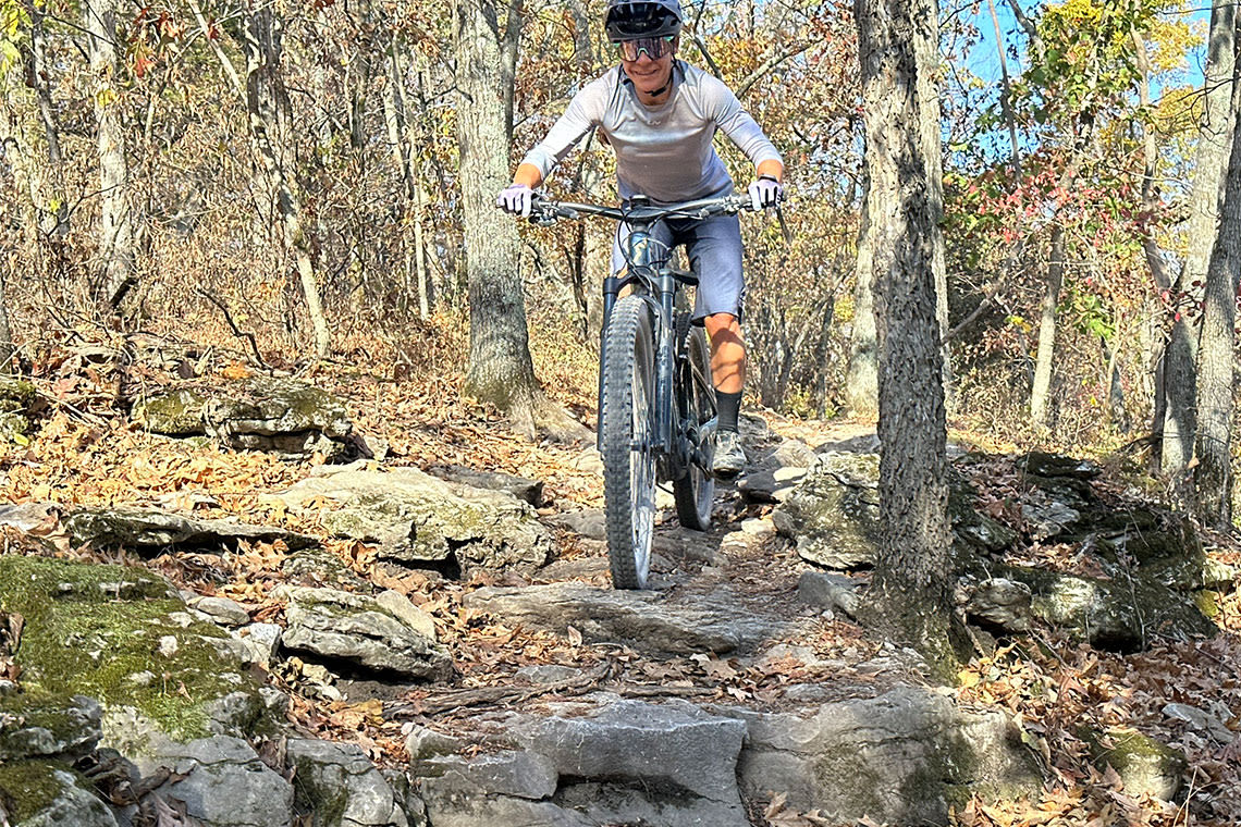 Liv athlete descending a technical trail