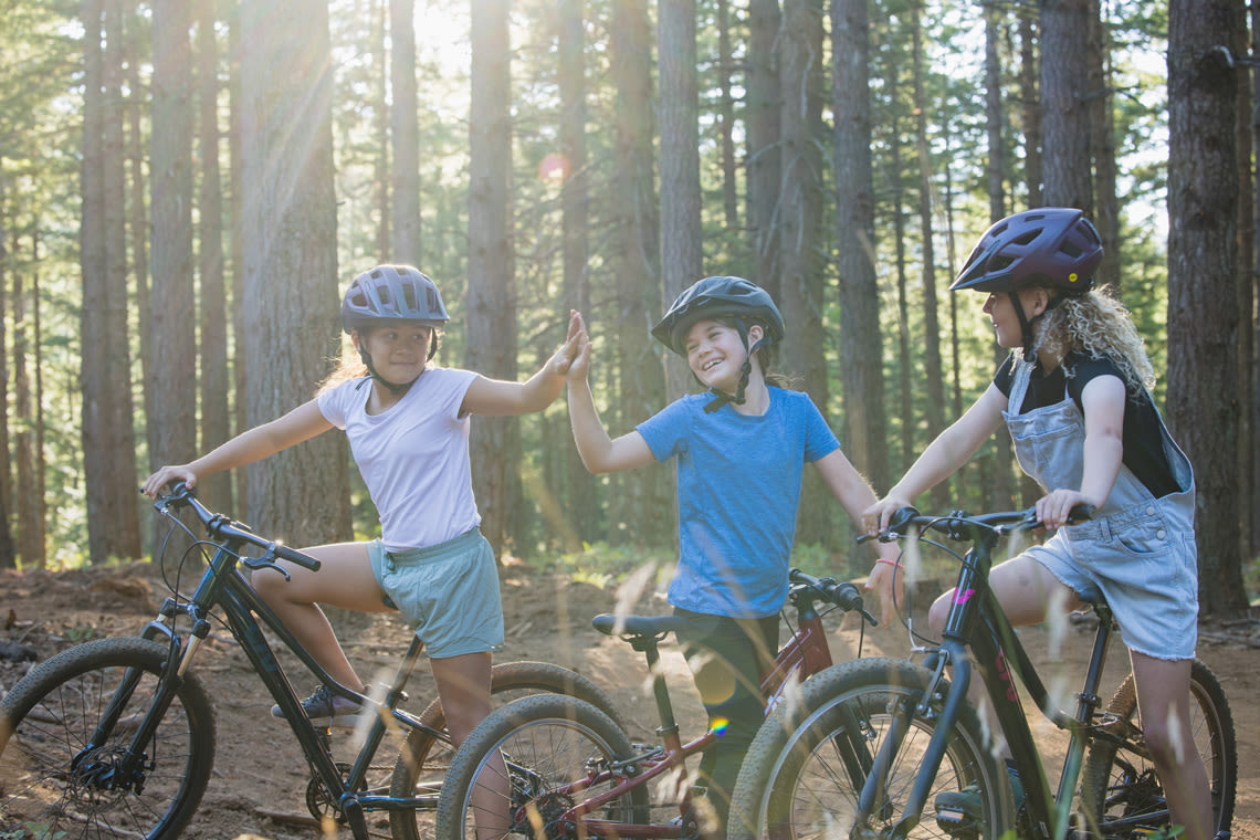 three girls on mountain bikes