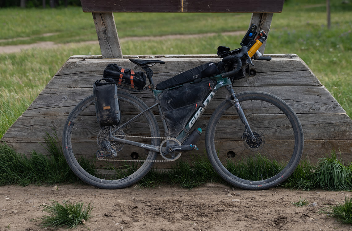 Gravel bike sitting alongside trail.