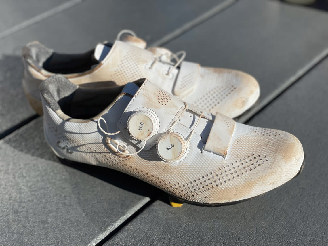dirty white road cycling shoes