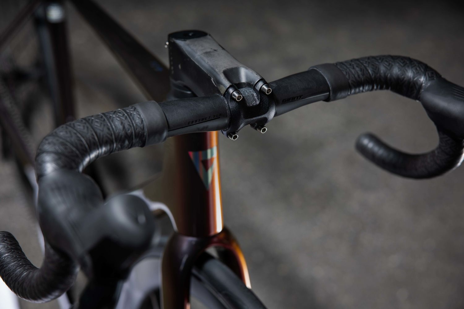 Close up view of Giant TCR Advanced SL cockpit featuring Giant SLR handlebar.