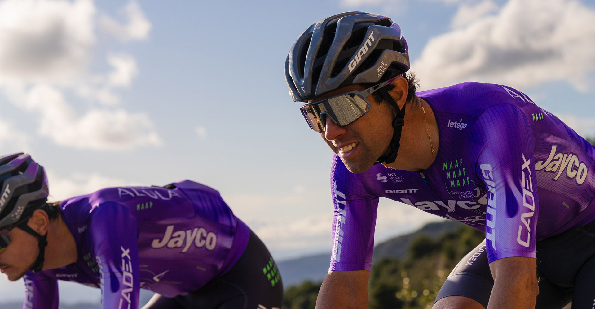 Road cyclist wearing sunglasses and helmet