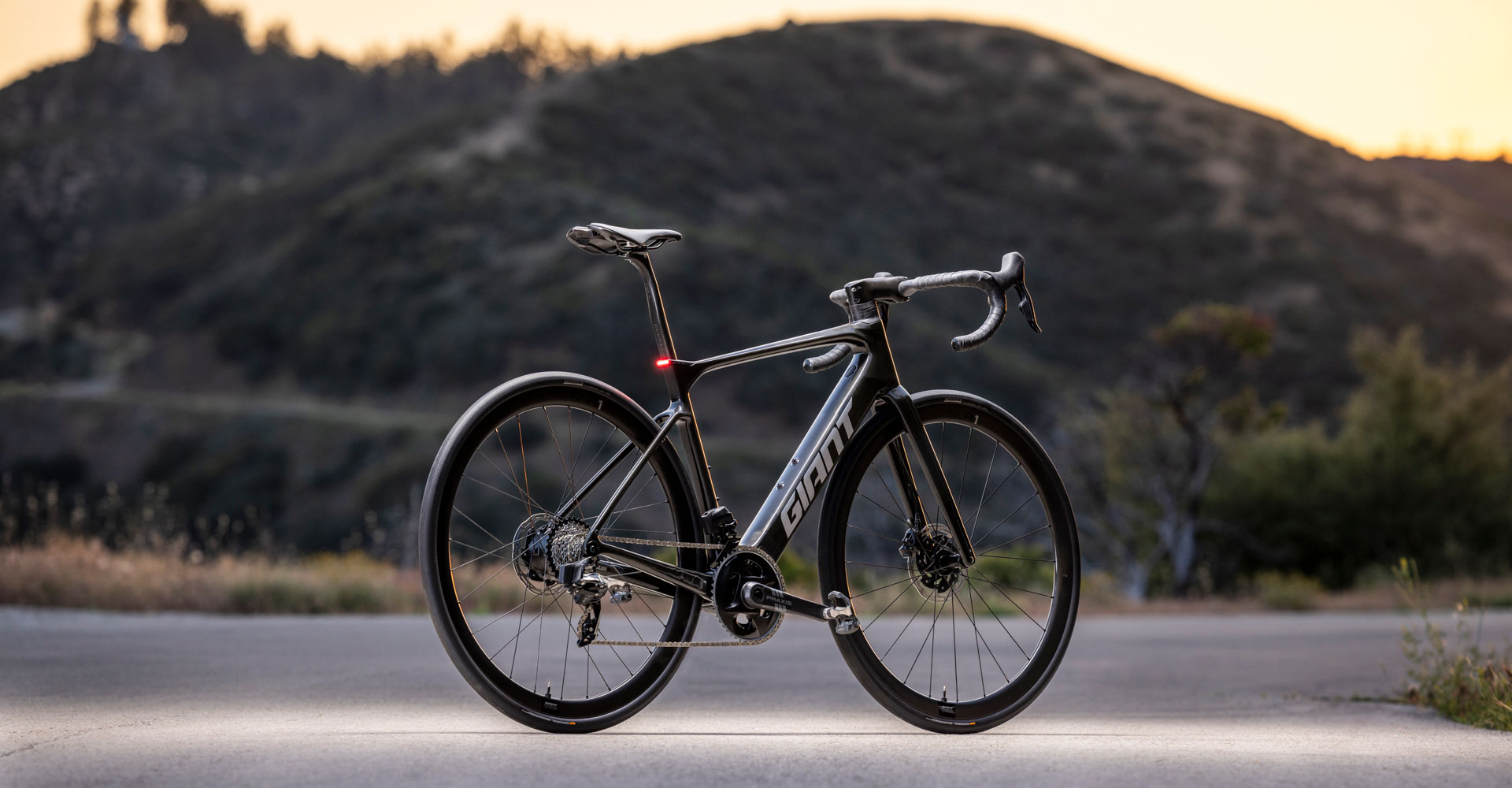 Defy E+ in profile on road