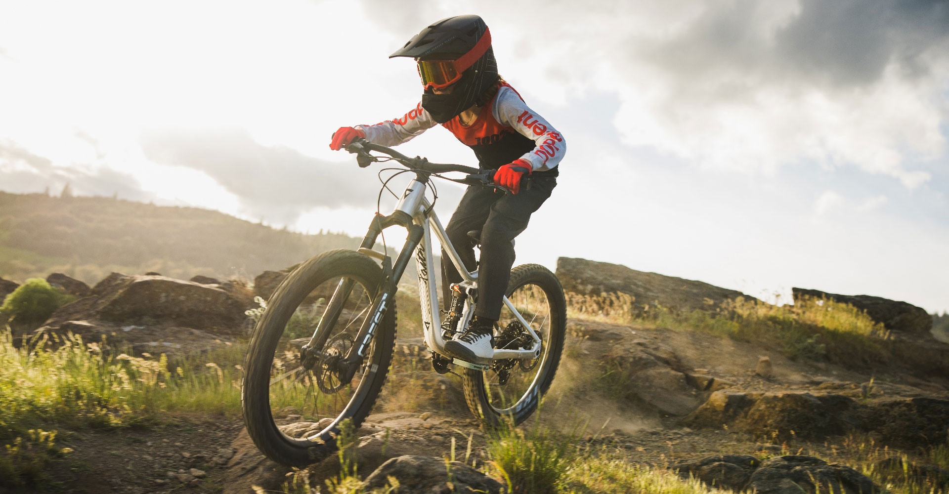 young rider with a full suspension bike