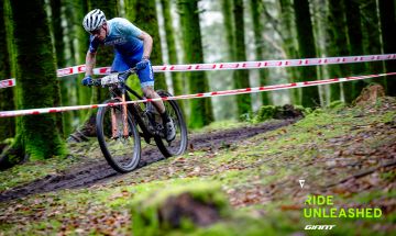 Mountain biker racing in the forest