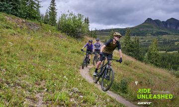 Family riding bikes in the mountains