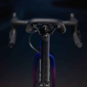 Rear view of the Giant Grit Core Lite saddle with dark mountain backdrop.