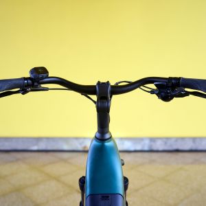 A POV look at the cockpit of a Giant NewTour E+ city bike.