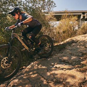 Woman riding the Intrigue X Advanced E+ Elite.