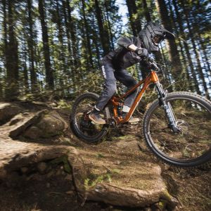 Young rider on youth full suspension bike