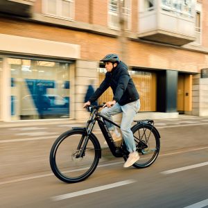 Ebiker riding adventure hardtail mountain bike in city