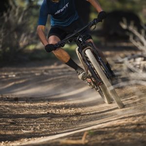 XC Mountain biker approaches in a turn on Giant Anthem Advanced with Crest SL Fork.