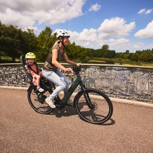 Woman riding Allure E+ with her daughter