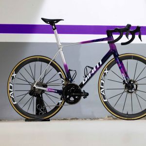 Giant TCR Advanced SL Team Bike staged with team Jayco team color background.