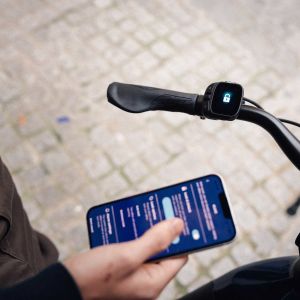 A cyclist syncs their Giant NewTour E+ with their phone.