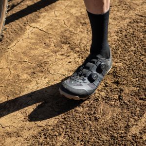 A close up of a cyclist wearing their Giant Charge gravel shoe.