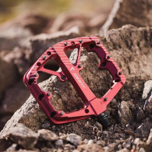 red flat pedals on rocks