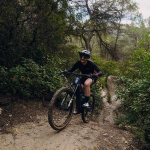 Girl riding Embolden E+0 up hill