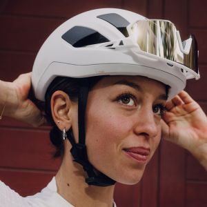 Girl wearing Liv Pursuit Mips helmet in white.