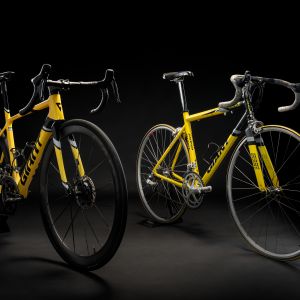 Giant TCR Legends edition and the classic Spanish team Once bike with a black background.