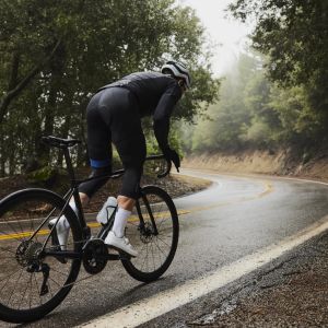Cyclist climbing out of the saddle on Giant Advanced Pro.