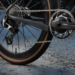 A close up look at the drivetrain on the Giant Revolt Advanced SL on a woodsy dirt road.