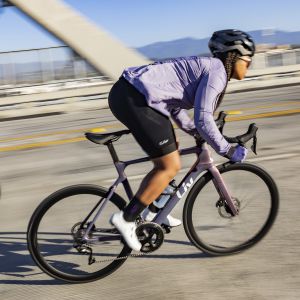 Woman riding across a bridge on the EnviLiv Advanced.