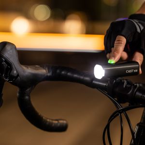 cyclist switching on cycling headlight