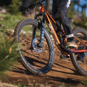 side profile of faith youth mountain bike in action