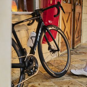 Giant TCR Advanced Pro leans up against general store.