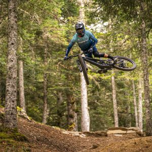 Enduro rider hitting a huge jump on Reign Advanced Pro