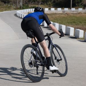 Cyclist rides with a Giant shadow seat bag on their road bike.