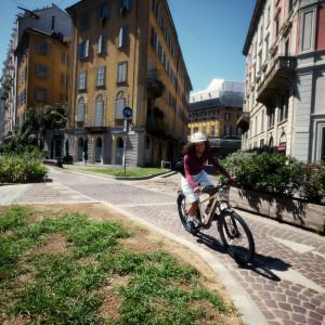 A cyclist traverses a cobbled bike path on her Liv Tempt E+ EX.