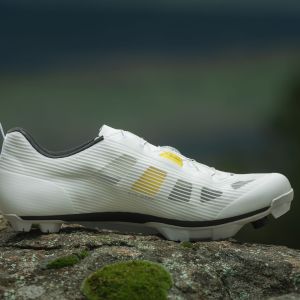 A close up look at the non-boa side of the Giant Charge Pro gravel/XC shoe on a rock.