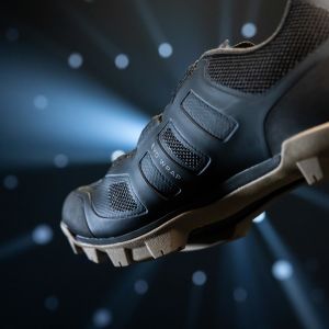 Liv Tesca shoe floating on a blue galactic backrgound.