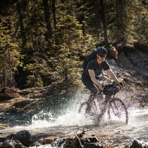 Riding Revolt E+ over a river