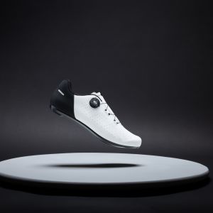 A side view of the Giant Surge road shoe in the white and black colorway.