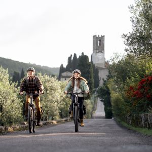 Cyclists on electric bikes riding in Europe