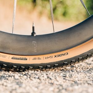 A close up look at the CADEX GXR tire on a dirt road.