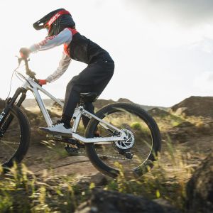 Young mountain bike rider on full suspension bike