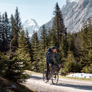 Rider in the mountains on Revolt E+ electric bike