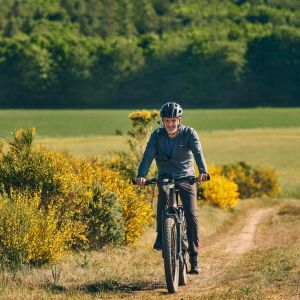 Cyclist on a country farm road