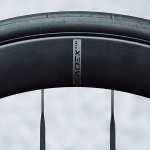 A close up look at the side of a black CADEX Aero Tire mounted on a CADEX wheel.