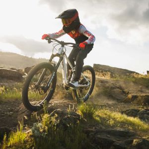 Young rider on 24" youth full suspension bike