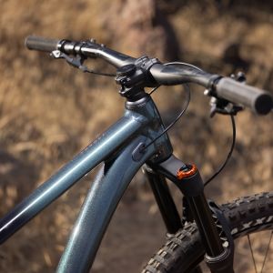 Side view of Crest TR Suspension Fork on Giant Trance trail bike on the side of a trail.